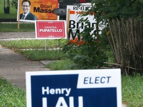 Windsor police are on the trail of a woman suspected of stealing election lawn sigs. Shown here on Oct. 3, 2019, is a cluster of federal election signs on Sandwich Street in West Windsor.