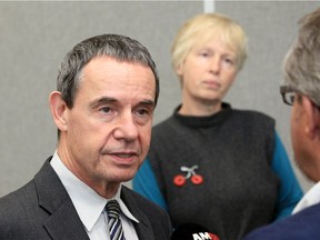 CAMPP's legal representative Eric Gillespie speaks to reporters at city hall on Tuesday, Oct. 8, 2019, following the opening day of a Local Planning Appeal Tribunal hearing into the proposed location of the new mega-hospital. Behind him is CAMPP's Philippa von Ziegenweidt.