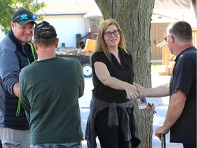 NDP candidate Tracey Ramsey, centre, gets an assist on the federal election trail by MPP Taras Natyshak (NDP—Essex) on Oct. 9, 2019. Here, the pair speaks with Viscount Estates resident Terry Marchand, right, and Dean Battersby during an evening campaign stop in Essex.
