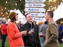 Hillary Montgomery, left, Mackenzie Ouellette and Ryan Preston enjoy the ambience of Windsor Craft Beer Festival at Willistead Park Friday.
