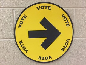 Round Elections Canada vote sign, at a Canadian voting station in the Optimist Community Centre on Ypres Boulevard, Oct. 21, 2019.