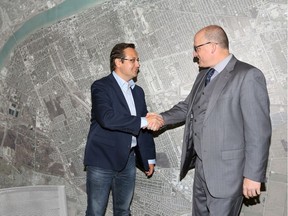 City councillor Irek Kusmierczyk, left, meets with Windsor Mayor Drew Dilkens the day after Kusmierczyk was elected as a Member of Parliament for the riding of Windsor-Tecumseh.