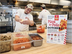 Antonino's Original Pizza manger Tony Mannina, left, and co-worker James Scott, prepare pies Tuesday as they team up with Armando’s, Arcata and BullsEye pizzerias as part of the Pizza for Polio campaign on World Polio Day. Part of the proceeds will go to Rotary International's Global Polio Education Initiative. Antonino’s also donated $10,000 to Family Respite Services as part of its recent grand opening.