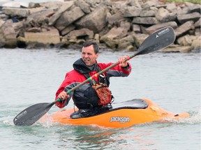 Bound for Peche Island, kayaker Bernie Dawson paddles from Windsor's Shanfield Shores Park on Riverside Drive East Tuesday.  Dawson was planning on two laps around Peche Island, just an average workout for the outdoorsman, who was using his 'whitewater' kayak.