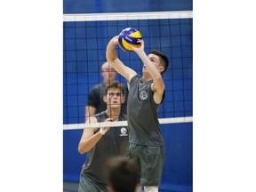 Setter Nolan Langley, front, with University of Windsor Lancers men's volleyball team, preparing for the team's OUA home opener on Friday.