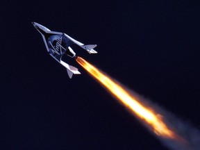 This April 29, 2013 handout image provided by MarsScientific.com and Clay Center Observatory, shows Virgin Galactic's SpaceShip2 under rocket power, its first ever since the program began in 2005. The spacecraft was dropped from its "mothership", WhiteKnight2 over the Mojave, California area, Monday at high altitude before firing its hybrid power motor. Virgin Galactic hopes to become the first commercial space venture to bring multiple passengers into space on a regular basis.