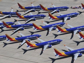 In this file photo taken March 28, 2019, Southwest Airlines Boeing 737 MAX aircraft are parked on the tarmac after being grounded, at the Southern California Logistics Airport in Victorville, California. U.S. aviation regulators came in for heavy criticism on Oct. 11, 2019, over lapses in certifying the Boeing 737 MAX aircraft, which has been grounded following two crashes that killed 346 people. The report, authored by a team of international aviation regulators, said the US Federal Aviation Administration lacked the necessary manpower and expertise to evaluate key flight-handling changes on the plane and also delegated too much to Boeing staff, hamstringing its ability to ensure the plane was safe.