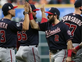 Washington Nationals right fielder Adam Eaton (2) celebrates with teammates after defeating the Houston Astros in game six of the 2019 World Series at Minute Maid Park on Oct. 29, 2019.