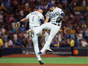 Tampa Bay Rays shortstop Willy Adames (1) and centre fielder Kevin Kiermaier (39) celebrate their win over the Houston Astros during the ninth inning in game four of the 2019 ALDS playoff baseball series at Tropicana Field on Oct. 8, 2019.