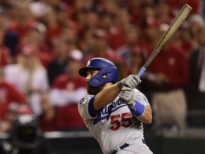 Los Angeles Dodgers catcher Russell Martin hits a two-RBI double in the sixth inning against the Washington Nationals in game three of the 2019 NLDS playoff baseball series at Nationals Park.