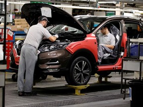 Workers are seen on the production line at Nissan's car plant in Sunderland Britain, October 10, 2019.