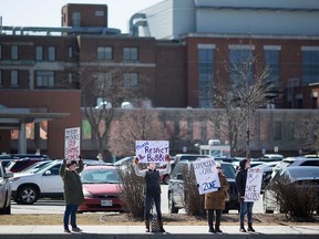 Pro-choice demonstrators stand by the Met Campus of Windsor Regional Hospital on March 23, 2019.