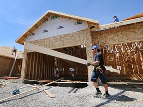 Joel Parent and his coworkers are shown a the construction site of a home in the 2200 block of Gatwick Avenue on Friday, Aug. 7, 2015, in Windsor, Ont.