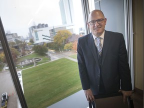 Mayor Drew Dillkens is pictured with the grass lot where the former city hall once stood, Wednesday, October 30, 2019. A half-dozen connected projects, creating vibrant public areas from city hall to Walkerville, are clumped together in a grant application that would see Ottawa and the province contributing $37 million toward the $57.3-million total.