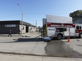 Windsor firefighters are shown on the scene of a fire on Drouillard Road at Maidstone Autobody on Sunday, Oct. 13, 2019. The fire started in the basement in the area of the furnace. There was $50,000 damage to the shop and $80,000 to a dwelling unit. No injuries were reported.