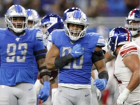 Detroit Lions defensive end Trey Flowers (90) celebrates after a play during the fourth quarter against the New York Giants at Ford Field on Sunday.