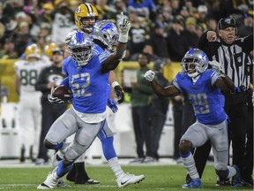 Detroit Lions linebacker Christian Jones (52) reacts after recovering a fumble in the first quarter during the game against the Green Bay Packers at Lambeau Field.