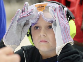 A Head Safe program from Scouts Canada and Hydro One was held at the Forest Glade Arena on Saturday, October 26, 2019. The event aimed at educating families to prevent, identify and treat concussions. Riley Stieler, 8, wears gloves, headphones and impairing goggles to get a sense of concussion symptoms.
