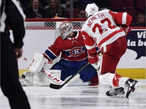 Montreal Canadiens goalie Carey Price (31) makes a pad save against Detroit Red Wings defenceman Patrick Nemeth (22) during the third period at the Bell Centre on Oct. 10, 2019.