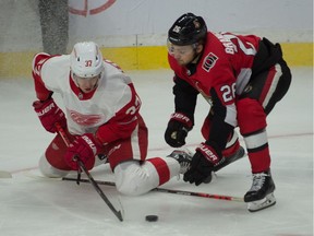 Detroit Red Wings right wing Evgeny Svechnikov battles with Ottawa Senators defenseman Erik Brannstrom in the third period at the Canadian Tire Centre.