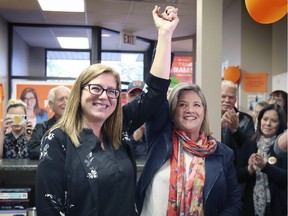 Tracey Ramsey, left, NDP candidate in the riding of Essex has her hand raised by Andrea Horwath, leader of the provincial NDP party, on Tuesday, October 15, 2019, at Ramsey's campaign office in Essex, ON.