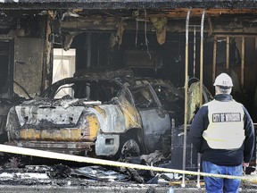 A destroyed car is shown inside a home in the 1600 block of Jefferson Boulevard on Saturday, Oct. 19, 2019. The home, unoccupied at the time, was also completely destroyed. The occupants of the vehicle escaped without serious injury.