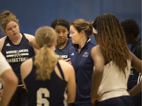 University of Windsor Lancers head coach Chantal Vallée  , centre, believes there will be benefits from fewer games and less travel for teams during the upcoming 2021-22 season.