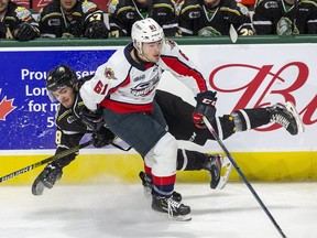 London Knights  Liam Foudy is dumped by  Connor Corcoran of the  Windsor Spitfires  in the first period of their game London Knig in London, Ont. on Friday October 18, 2019.