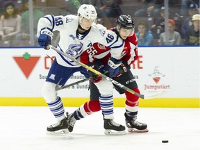 Windsor Spitfires' rookie centre Wyatt Johnston, seen at right in action against Mississauga Steelheads' Thomas Harley, was selected by Hockey Canada to play at the World Under-17 Hockey Challenge.