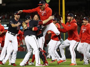 The Washington Nationals celebrate after beating the St. Louis Cardinals in the National League Championship Series at Nationals Park on October 15, 2019 in Washington. (Patrick Smith/Getty Images)