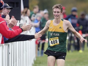 Freshman Carter Free, from St. Clair Saints, wins the OCAA men's cross-country championship on Saturday at Malden Park.