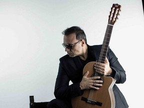 Award-winning virtuoso of Mediterranean guitar Pavlo in a promotional portrait.