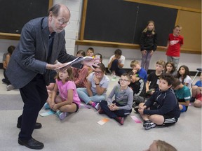 Poet laureate emeritus, Marty Gervais, reads a Vanessa Shields poem "The 46 Tornado" at St. Rose Catholic Elementary School, Thursday, October 3, 2019, where they are in their final day of a two-week read-a-thon.  Other special guests included Mayor Drew Dilkens, members of the University of Windsor track and field team, Mary Duckworth, Caldwell First Nation chief, among others.  The school is raising money to improve their IT equipment.