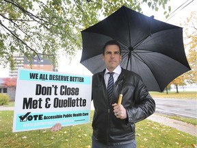 Windsor realtor Rhys Trenhaile with the pro-CAMPP sign that an angry motorist ripped out of Trenhaile's lawn. Trenhaile says he's surprised and disappointed the mega-hospital debate has become so contentious. Photographed Oct. 30, 2019.