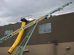 This July 15, 2016, file photo shows the roof at GoodLife Fitness where a worker was fatally injured while working on the roof.