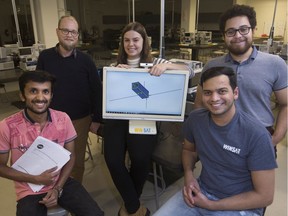 From left, Cole Nadalin, vice president and business lead, University of Windsor Space and Aeronautics Team, and students from the team, Karamballi Manoj Surabaya, Madeline McQueen, Sourish Sangwan, and Marco Veliz Castro, are pictured at the Ed Lumley Centre for Engineering Innovation with a cube sat design, Thursday, Oct. 31, 2019.