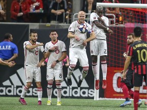 Toronto FC midfielder Michael Bradley (4) defends a free kick against Atlanta United in the first half at Mercedes-Benz Stadium.