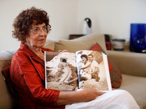 Nadia, widow of Israeli spy Eli Cohen, shows a photograph of herself with her late husband, during an interview with Reuters in Herzliya, Israel October 6, 2019.