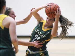 Mackenzie Schroeder, left, from Niagara College pressures Kimberly Orton from St. Clair College during their game on Saturday at the SportsPlex.