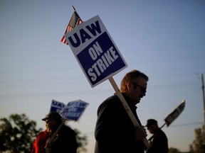 Striking union auto workers walk the picket line outside the General Motors Flint Truck Assembly in Flint, Michigan, U.S., October 9, 2019.