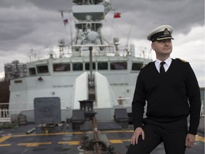 Cmdr. Peter Sproule stands on the bow of the Royal Canadian Navy frigate HMCS St. John’s while it's docked at Dieppe Gardens, Tuesday, October 22, 2019.