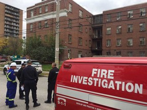 Windsor fire investigators and members of the Ontario Fire Marshal's office confer on Oct. 25, 2019, at the Windsor Court Apartments building, 1616 Ouellette Ave., scene of a fatal fire the night before.