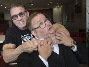Wrestler Ken Shamrock puts a choke hold on former Windsor wrestler, Scott D'Amore, who is now part owner of AXS TV, while at the Best Western Hotel in downtown Windsor, Thursday, Oct. 24, 2019.