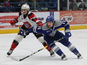 Blake McConville, right, of the Sudbury Wolves, and Merrick Rippon, of the Ottawa 67's, battle for position during OHL playoff action at the Sudbury Community Arena in Sudbury, Ont. on Thursday April 11, 2019. John Lappa/Sudbury Star/Postmedia Network ORG XMIT: POS1904112031370862 ORG XMIT: POS1904112155561094