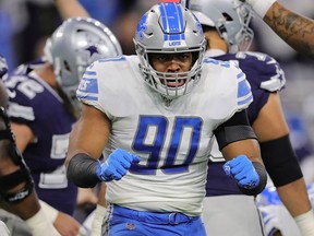 Trey Flowers of the Detroit Lions reacts on quarterback Dak Prescott of the Dallas Cowboys (not pictured) during the first quarter of the game at Ford Field on November 17, 2019 in Detroit, Michigan.