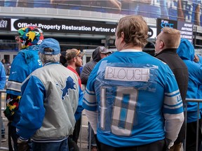 A Detroit Lions fan wears a taped on David Blough jersey prior to the start of the game against the Chicago Bears at Ford Field on November 28, 2019 in Detroit, Michigan.