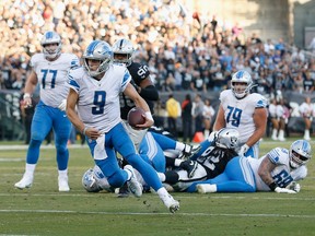 Quarterback Matthew Stafford of the Detroit Lions runs the ball toward the endzone in the fourth quarter against the Oakland Raiders at RingCentral Coliseum on November 03, 2019 in Oakland, California.