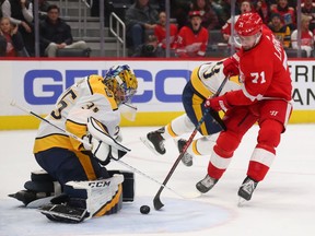 Dylan Larkin of the Detroit Red Wings takes a shot on Pekka Rinne of the Nashville Predators during the second period at Little Caesars Arena on November 04, 2019 in Detroit, Michigan. Nashville won the game 6-1.