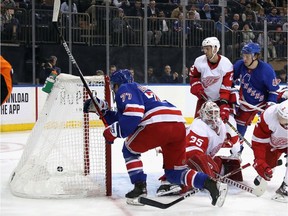Tony DeAngelo #77 of the New York Rangers scores a second period goal on Jimmy Howard #35 of the Detroit Red Wings at Madison Square Garden on November 06, 2019 in New York City.