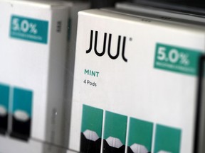 Packages of Juul mint flavored e-cigarettes are displayed at San Rafael Smokeshop on November 07, 2019 in San Rafael, California. Juul, a leading e-cigarette company, announced that it is halting sales of their popular mint flavor e-cigarette after the release of two studies that showed a surge in teen use.